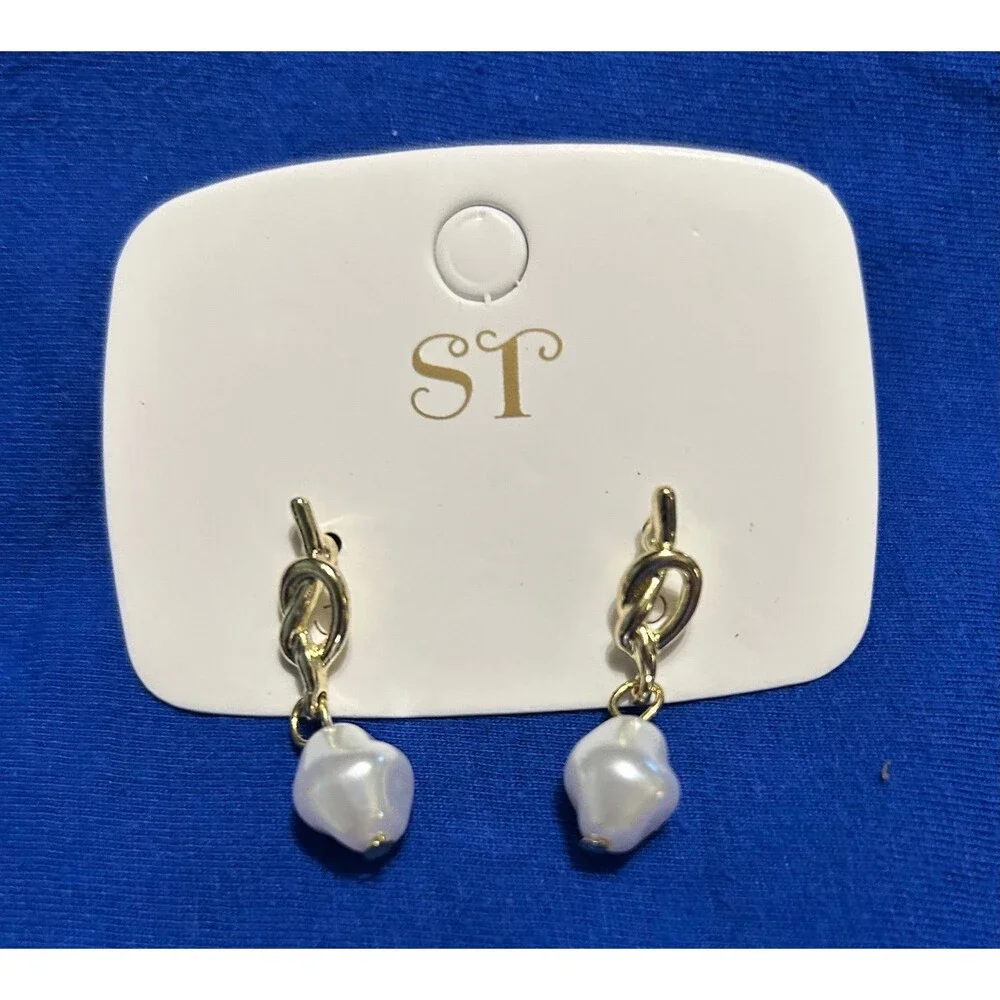 2 pairs of New earrings 1 pair is gold and silver 1 pair is white pearl
